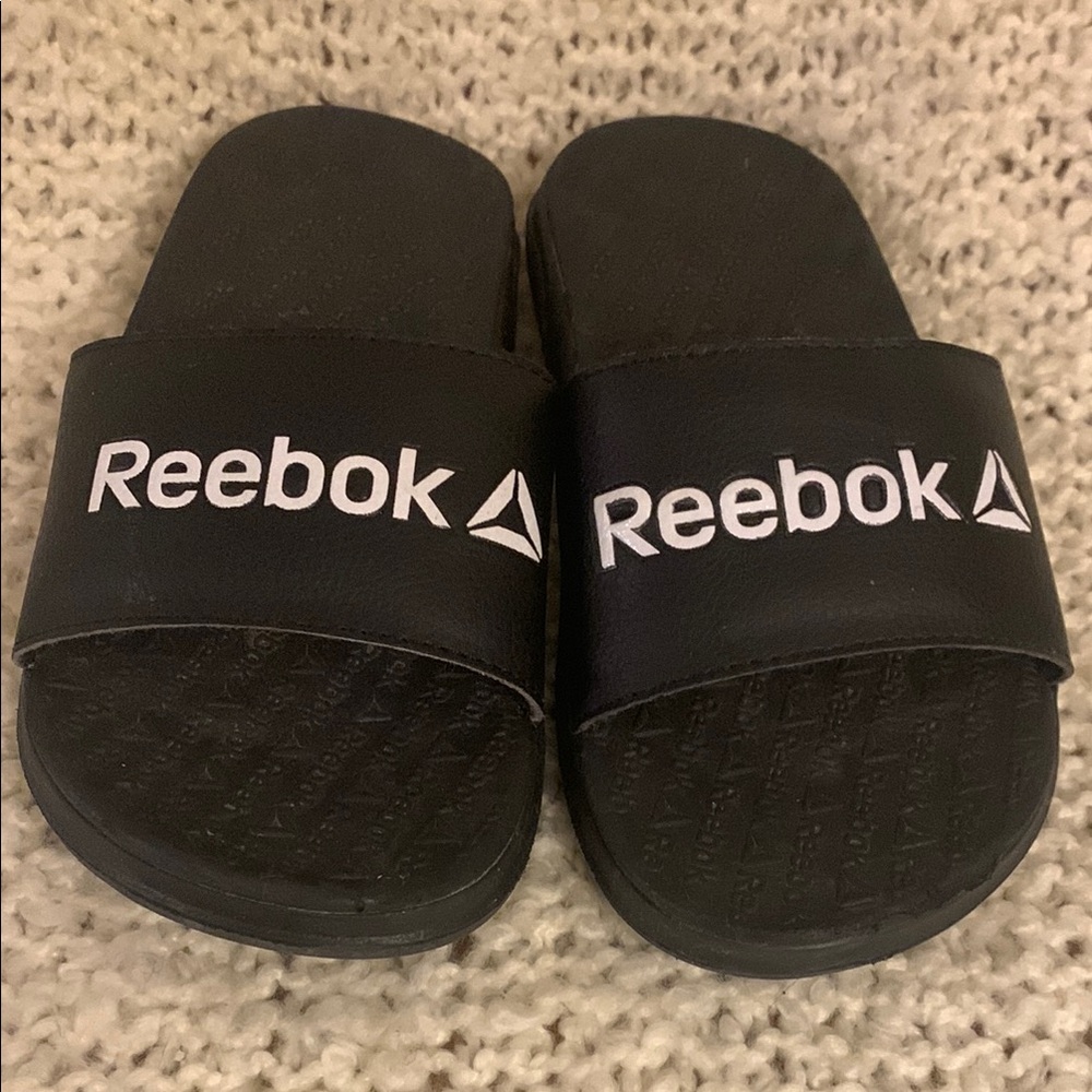 Kids Reebok black and white slide sandals, size 13.